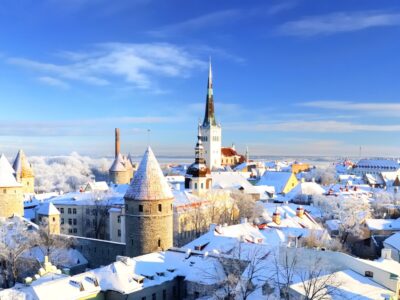 Panoramic view of the Tallinn old town on a clear winter day. Snow-covered trees and roofs. Estonia